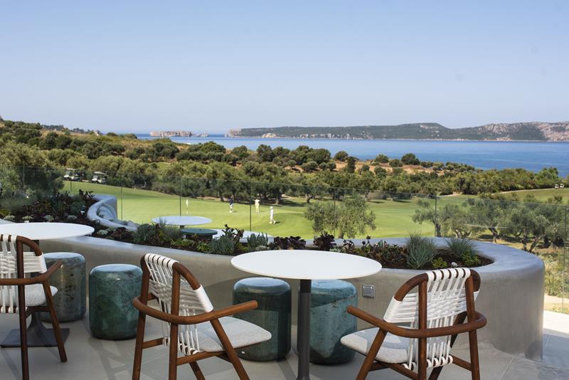 Costa Navarino Bay Course clubhouse balcony with a view on the golf course and the sea