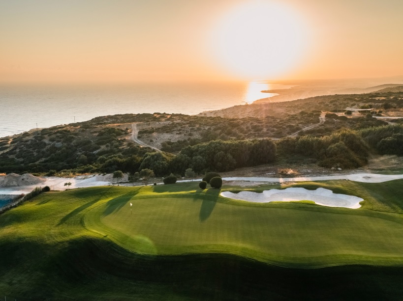 Aphrodite Hills Golf Resort golf course in sunset ClubstoHire
